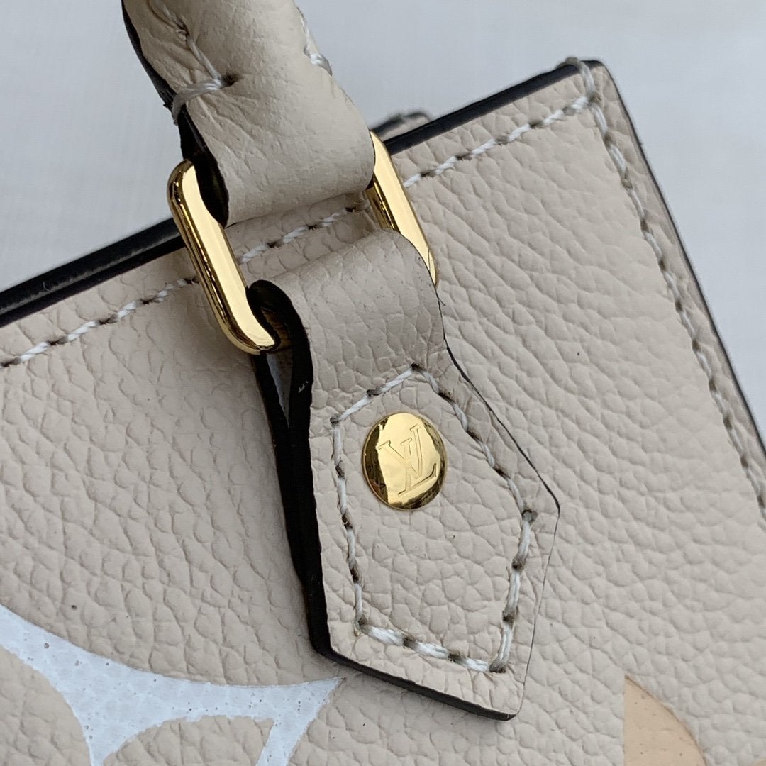 LV PETIT SAC PLAT CREME MONOGRAM EMPREINTE RINDSLEDER