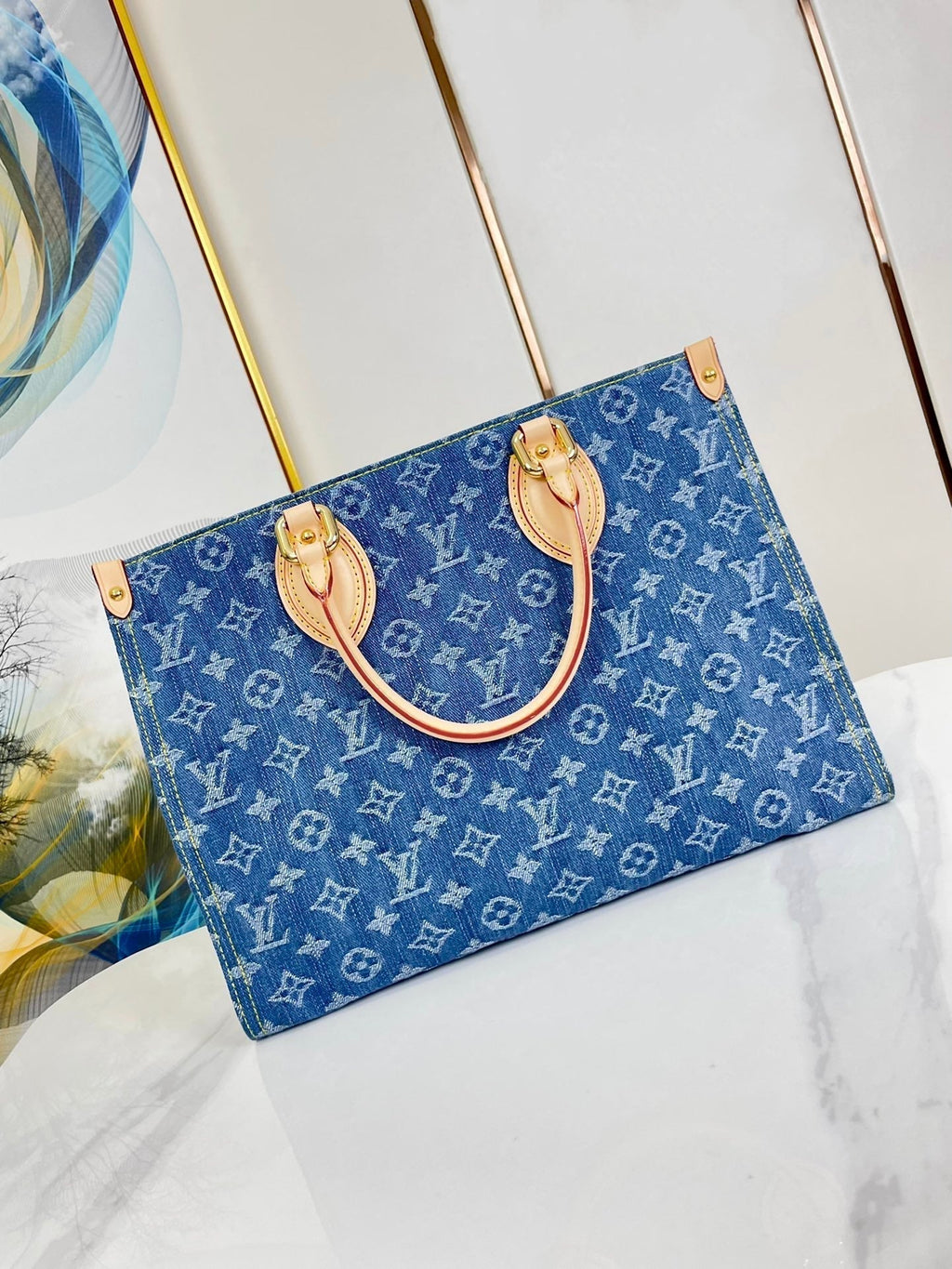 ONTHEGO 35 IN BLAUEM MONOGRAMM-DENIM