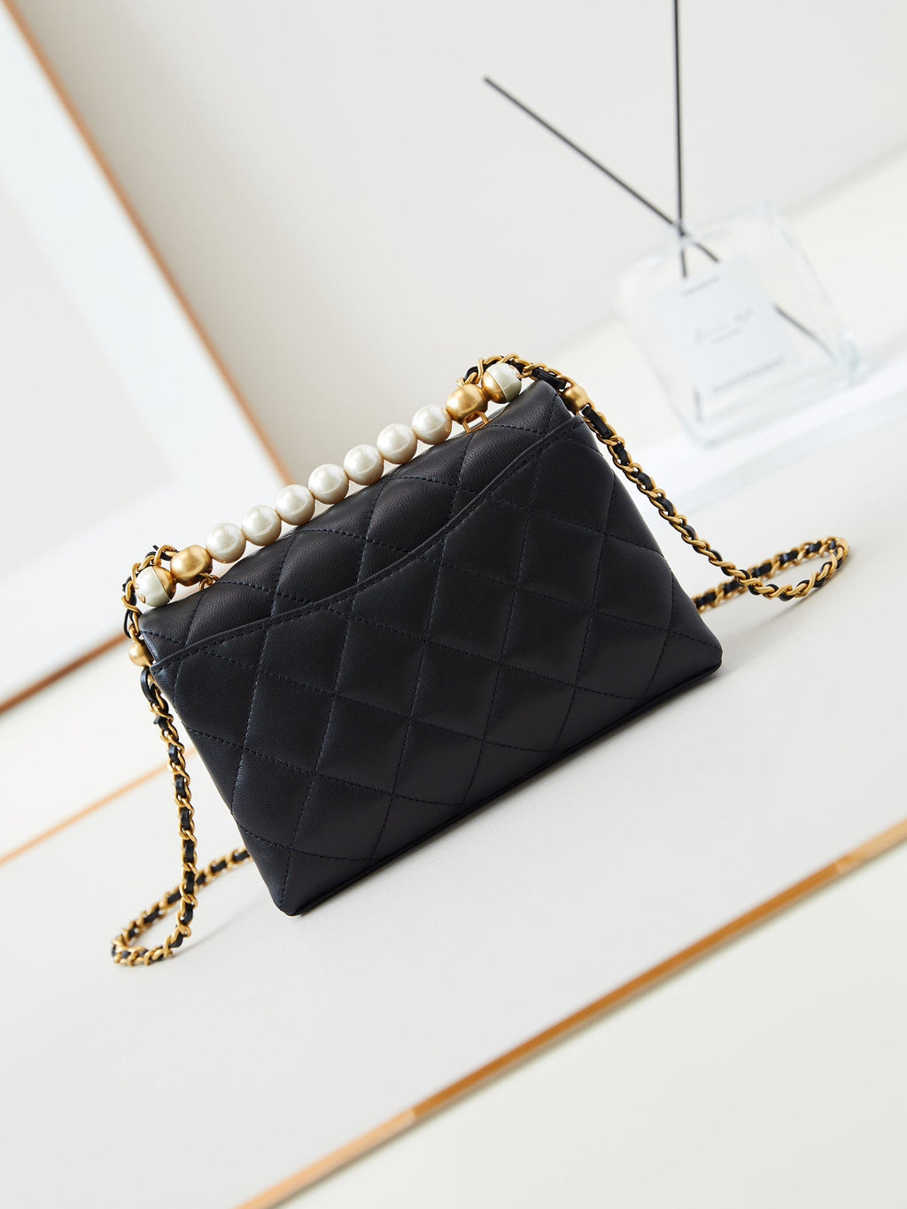 PEARL ATTACHED FLAP BAG 19 IN BLACK QUILTED LAMBSKIN GOLD HARDWARE