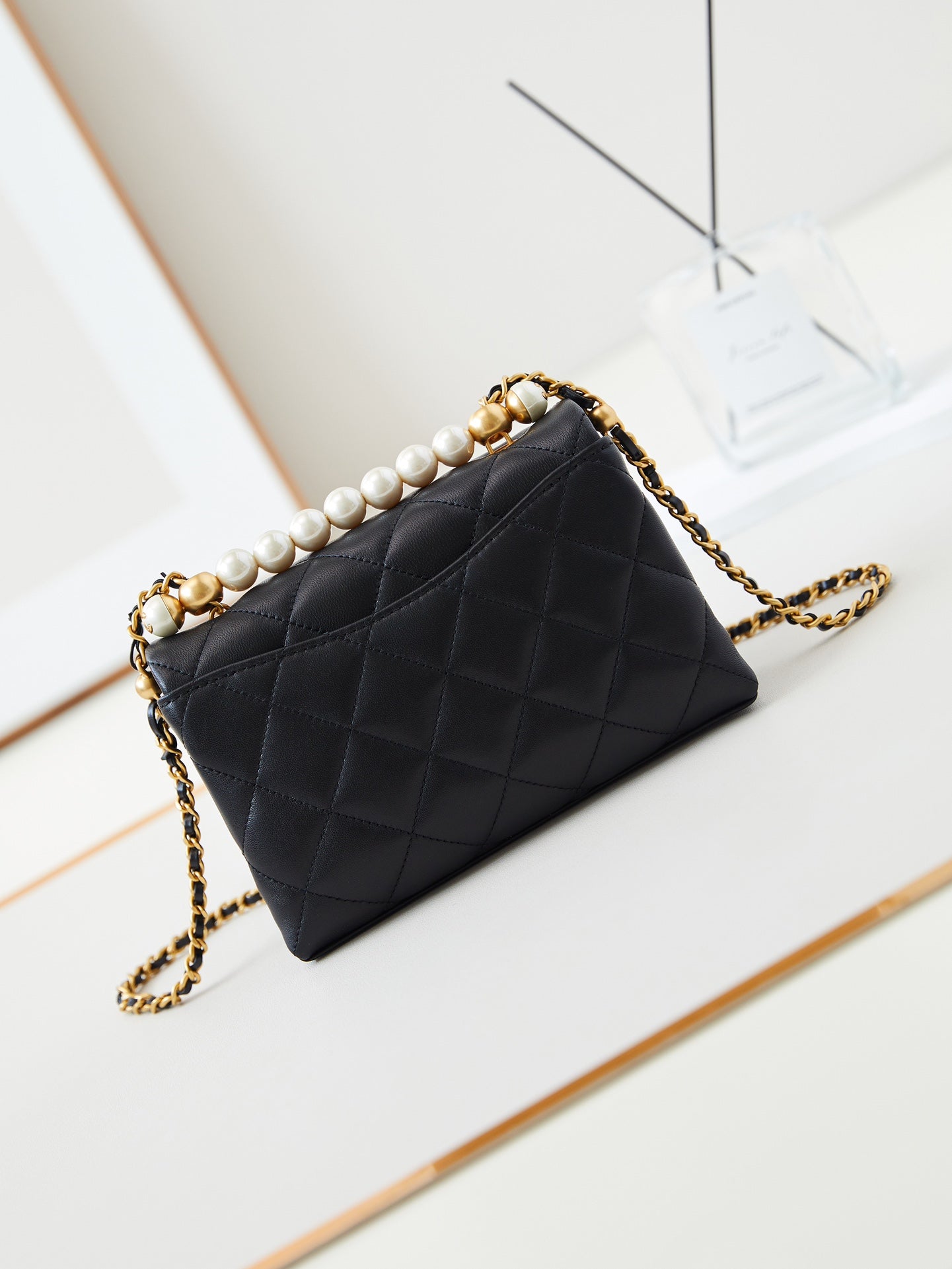 PEARL ATTACHED FLAP BAG 19 IN BLACK QUILTED LAMBSKIN GOLD HARDWARE