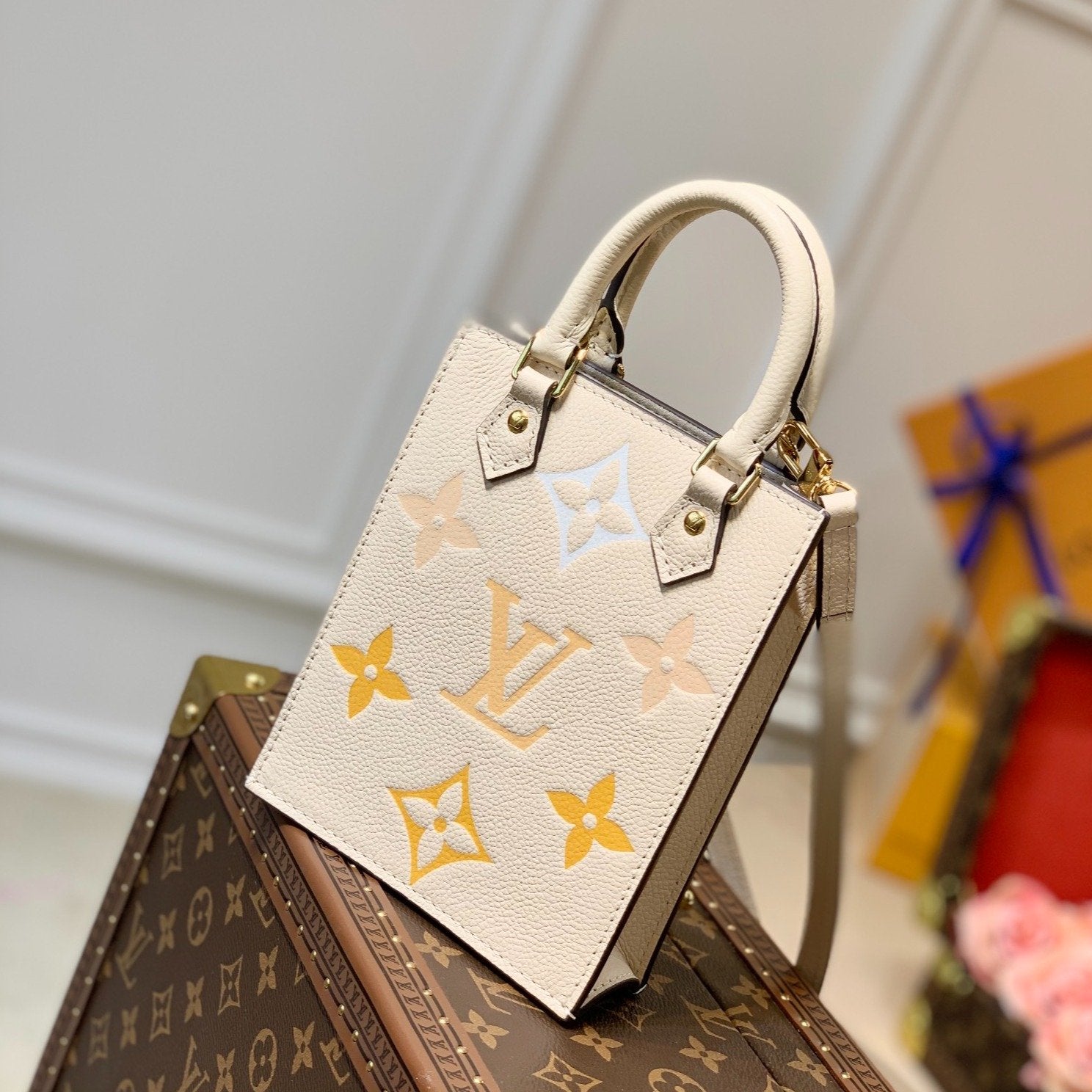 LV PETIT SAC PLAT CREME MONOGRAM EMPREINTE RINDSLEDER