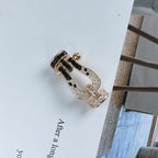 Jewelicorn FORCE Großes Hufeisen-Armband Schwarz Weiß Diamanten Roségold