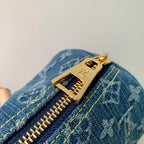 PAPILLON 27 IN BLAUEM MONOGRAMM-DENIM GOLDENE HARDWARE