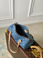 PAPILLON 27 IN BLAUEM MONOGRAMM-DENIM GOLDENE HARDWARE