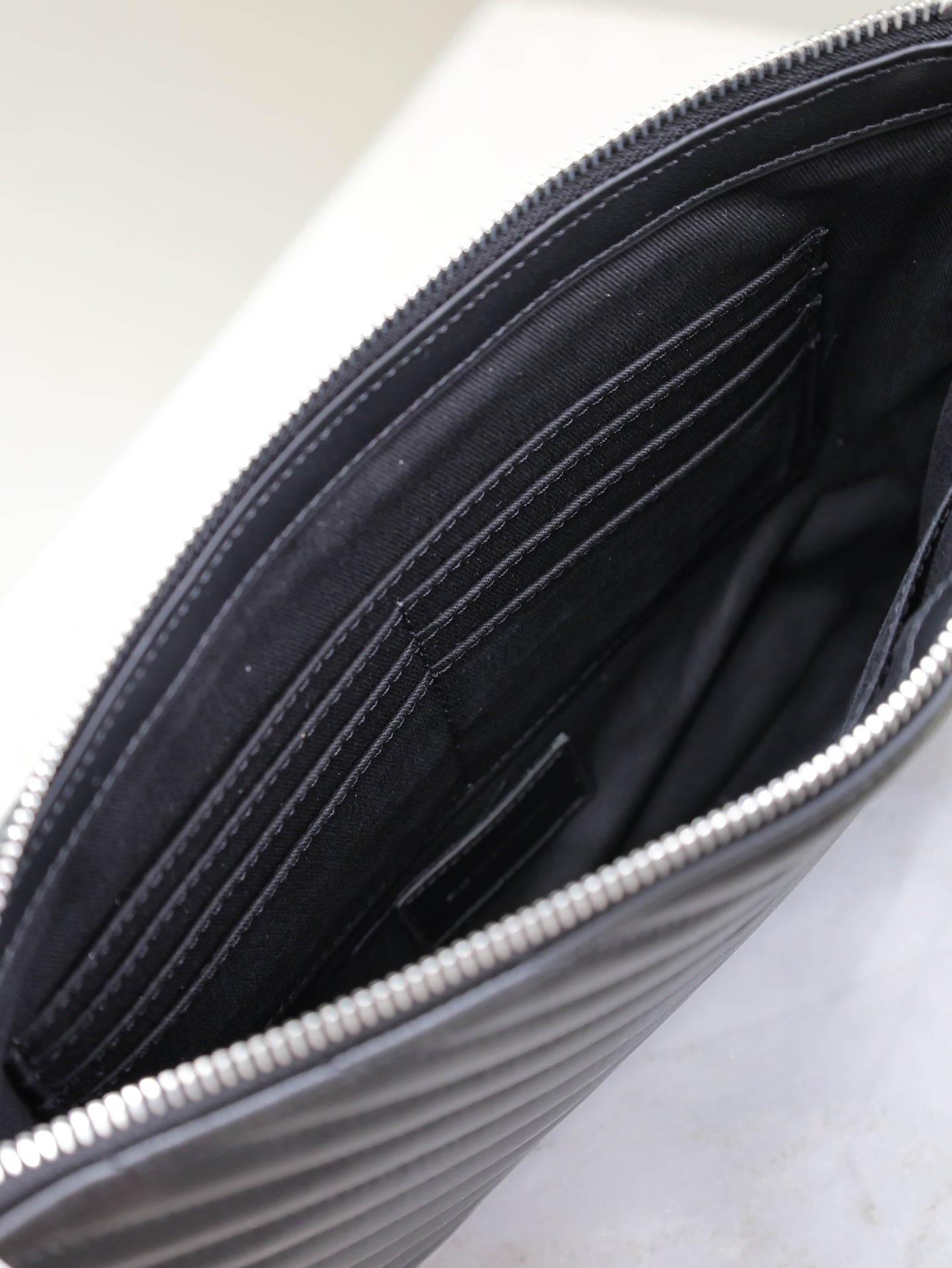 CLUTCH 30 IN BLACK QUILTED CALFSKIN SILVER BUCKLE